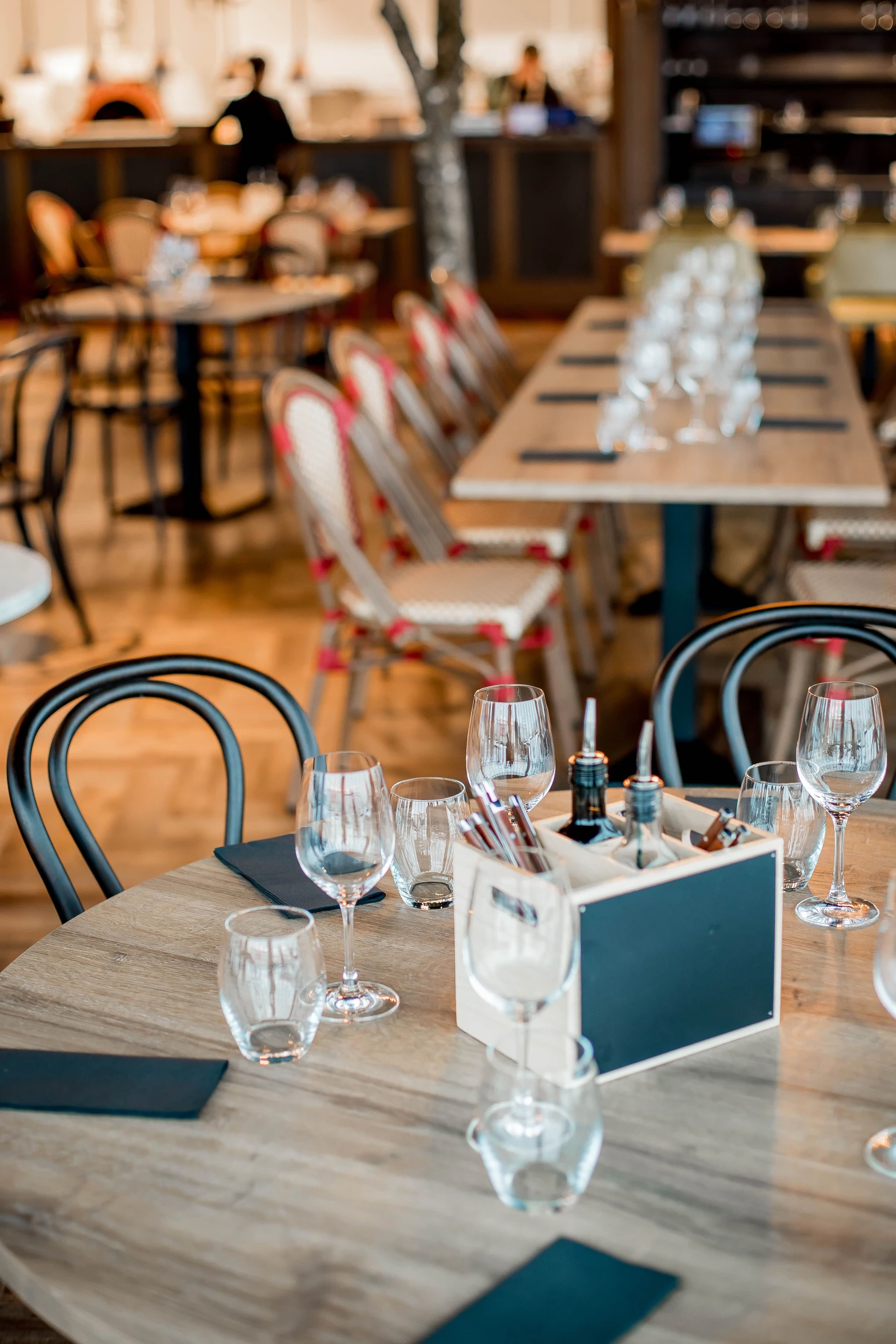 Restaurant tables set with glassware before service